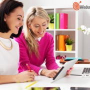 Two women looking at tablet computer